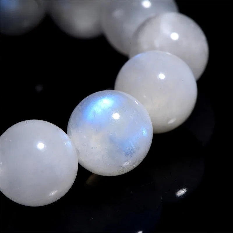 Blue moonlight polished moonstone bead bracelet with round beads in geometric arrangement