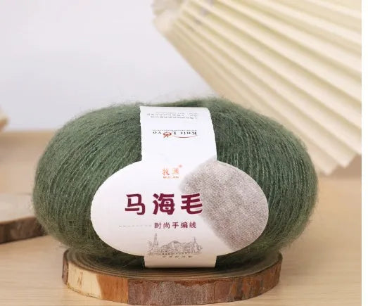 Single ball of mohair yarn in various colours for hand-woven DIY scarf knitting projects