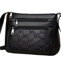 Butterfly black PU leather women's crossbody messenger bag showing embossed pattern and horizontal square shape
