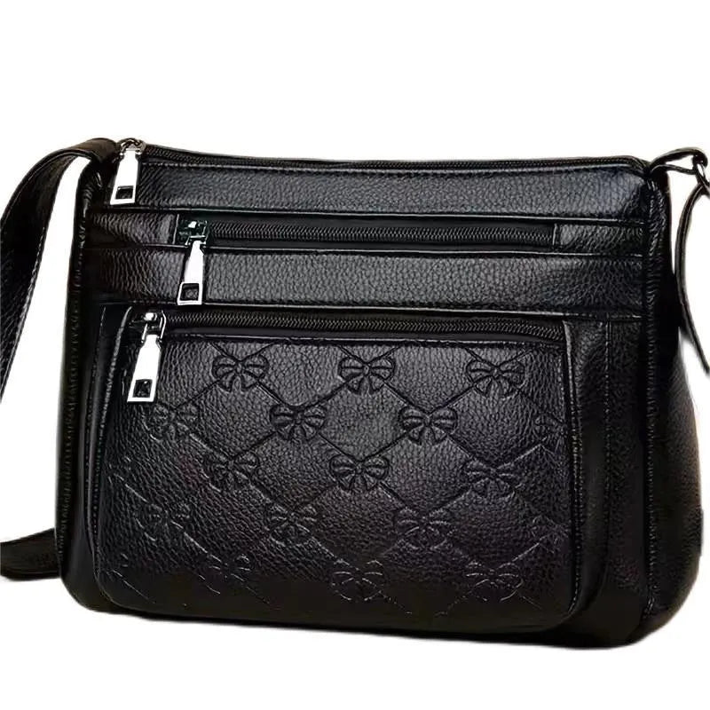 Butterfly black PU leather women's crossbody messenger bag showing embossed pattern and horizontal square shape