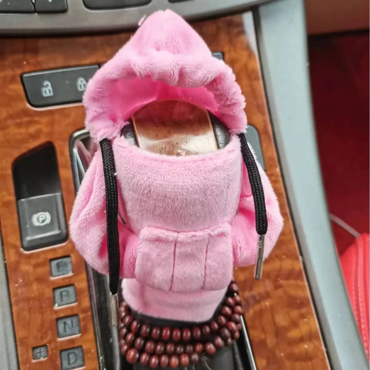 Soft Dutch velvet car gear handle cover in multiple colours on a gear stick.