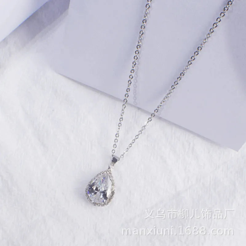 Pink water drop geometric necklace with rose gold electroplating and rhinestone detailing on alloy pendant