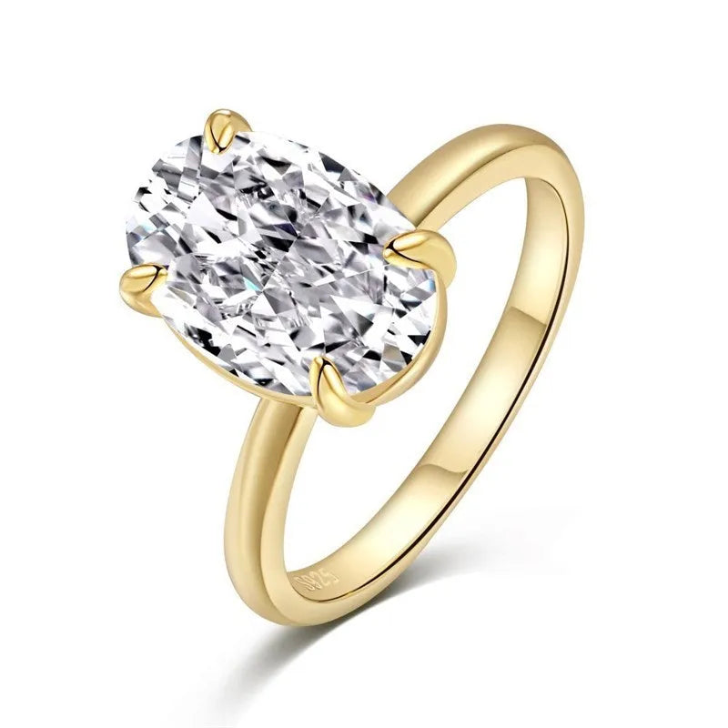 Oval women's ring with four-prong claw setting in gold or silver finish on a 9 silver band.