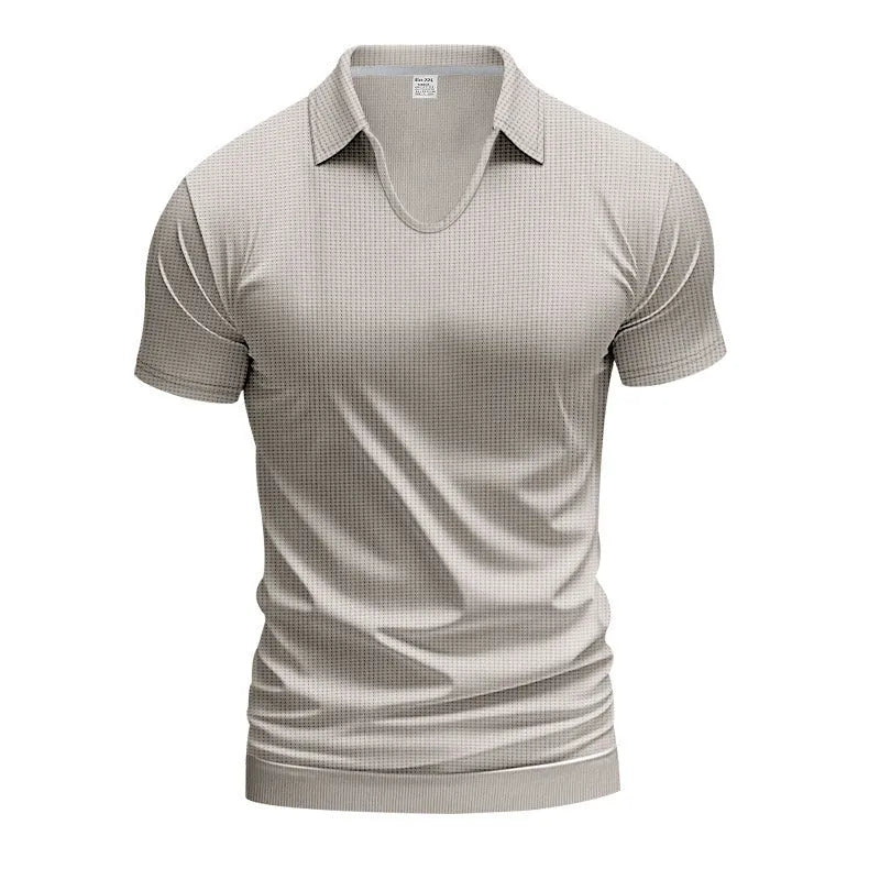 Man wearing a loose-fit apricot coloured V-neck short sleeve cotton blend T-shirt.