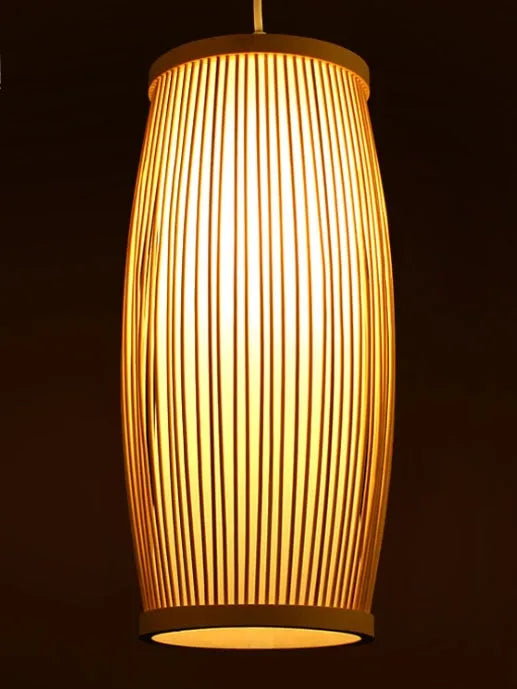 Natural bamboo plait cylindrical wall lamp with woven texture, shown mounted.