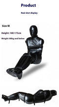 Black patent leather bondage set with body wrap garment and six ratchet tie-down straps