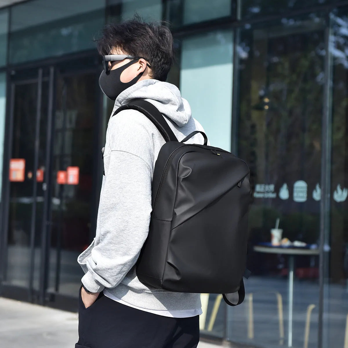 Men's waterproof backpack in black colour made from PU leather with large capacity design