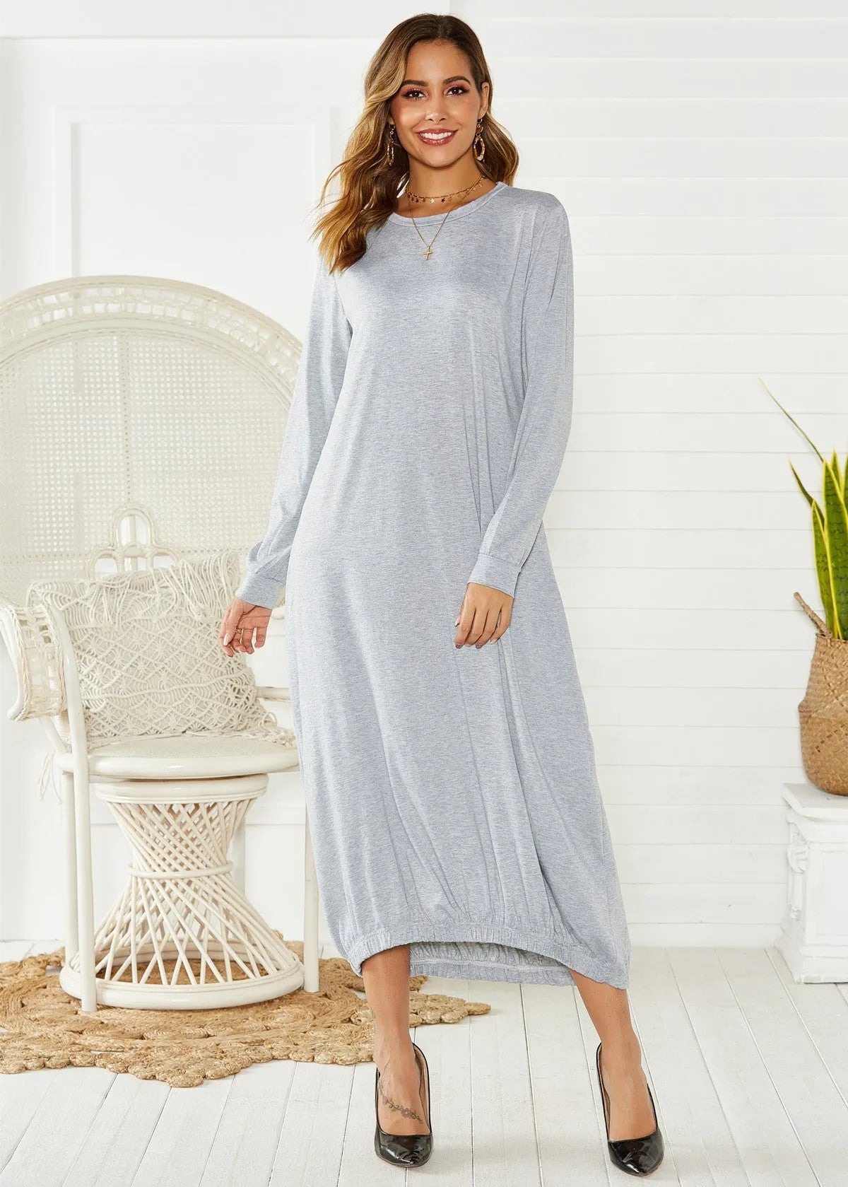 Black loose lantern dress with lace-up crew neck and long sleeves on mannequin