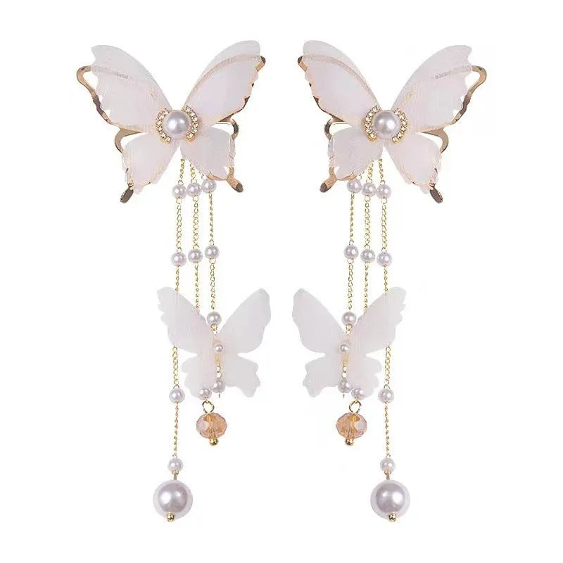 White butterfly earrings with tassel lace pearls and rhinestone decorations on copper alloy