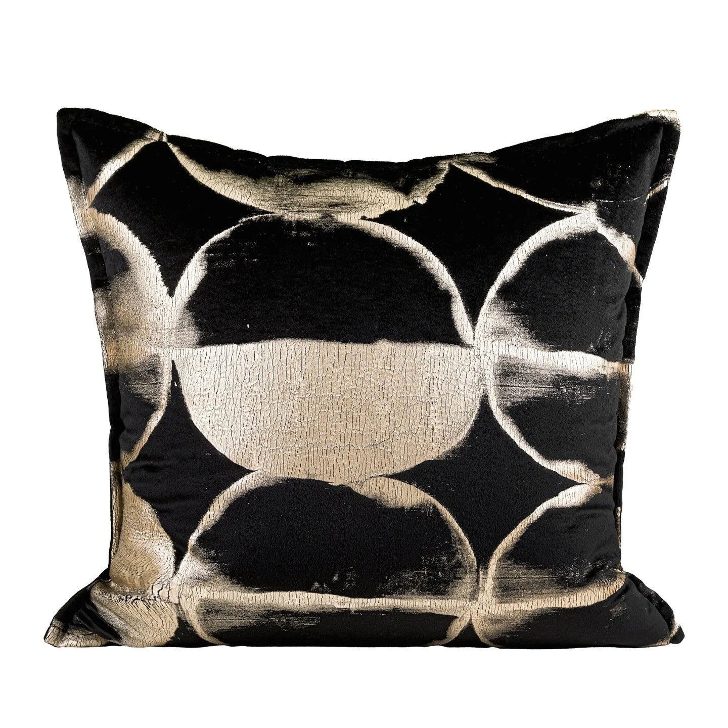 Black and gold abstract patterned flannel sofa cushion with removable cover on a grey sofa.