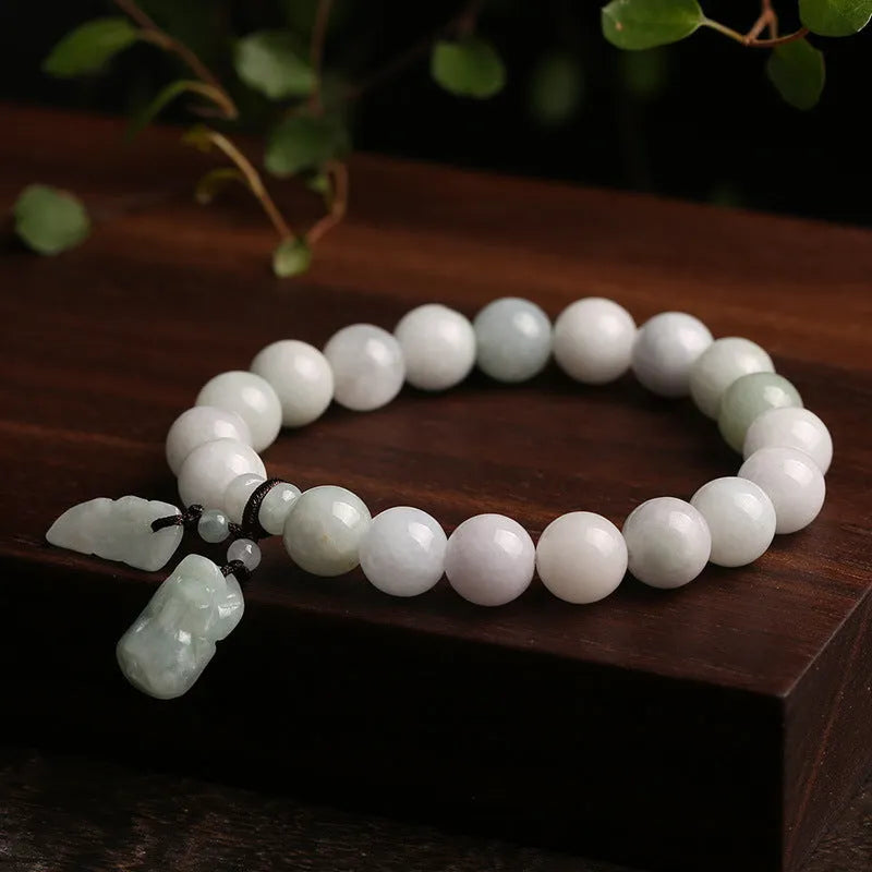 Natural emerald jade geometric bracelet with Maitreya Buddha, apple, and money bag hanging charms.