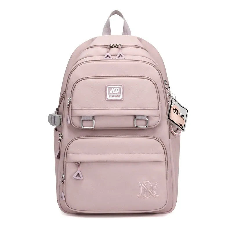 Large purple girls' nylon school backpack with a physiological curve backpanel on a white background.