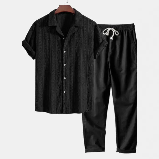 Men's casual camouflage print cardigan suit with short sleeve shirt and trousers on a hanger.