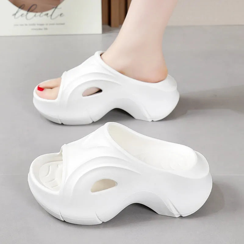 Women's thick-soled EVA slippers in rose red colour showing round toe design