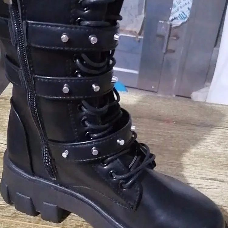 Black women's mid-calf boots with metal buckle detail and a side zip fastening.