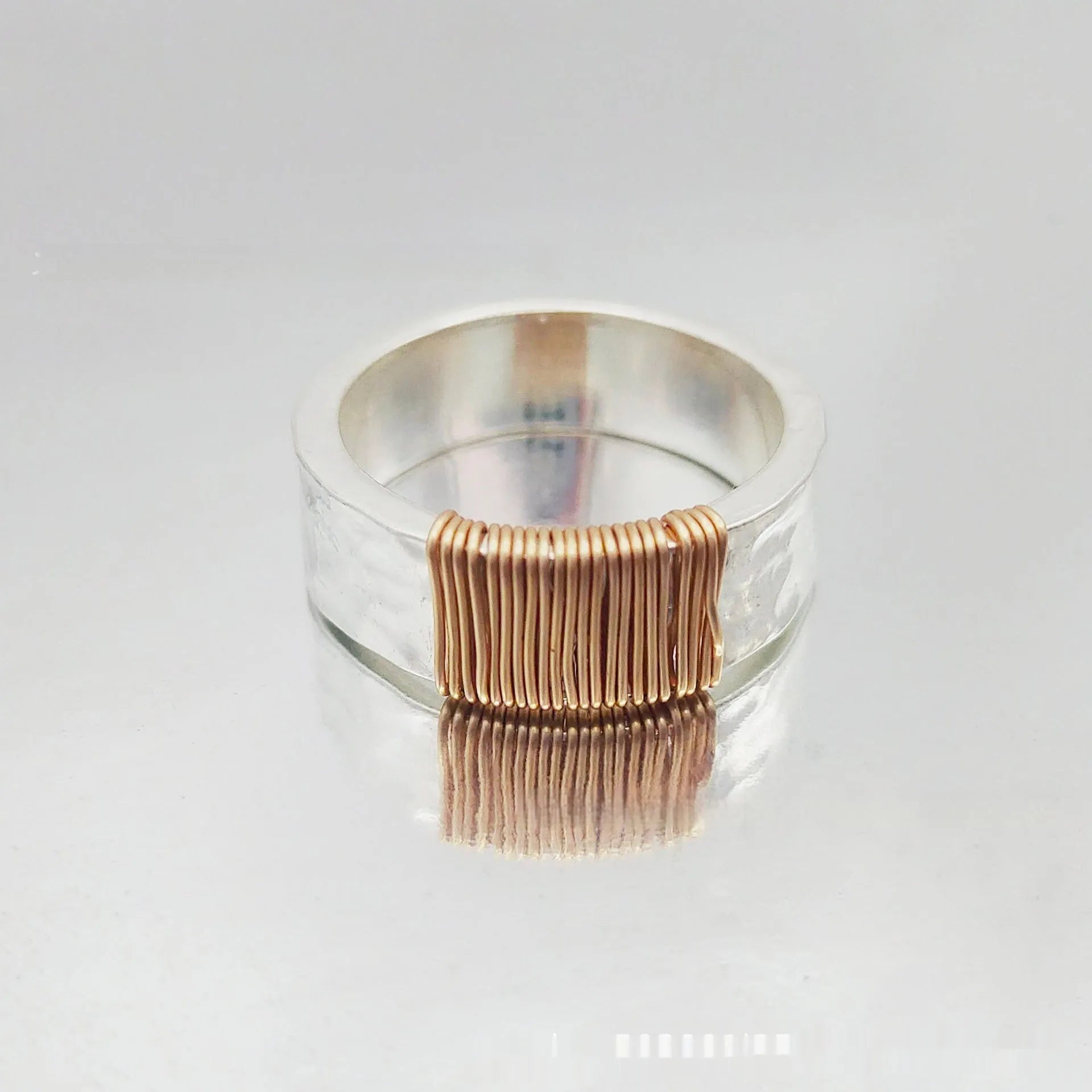 Geometric wide face copper bracelet with irregular coil design in silver golden colour
