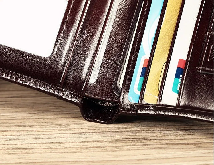 Men's leather wallet showing internal card slots, coin compartment, and document section