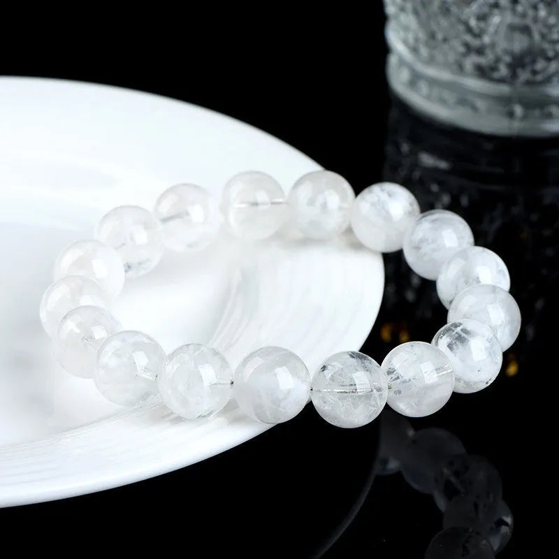 Women's crystal bracelet with natural blizzard snowflake round beads and ruyi xiangyun design elements