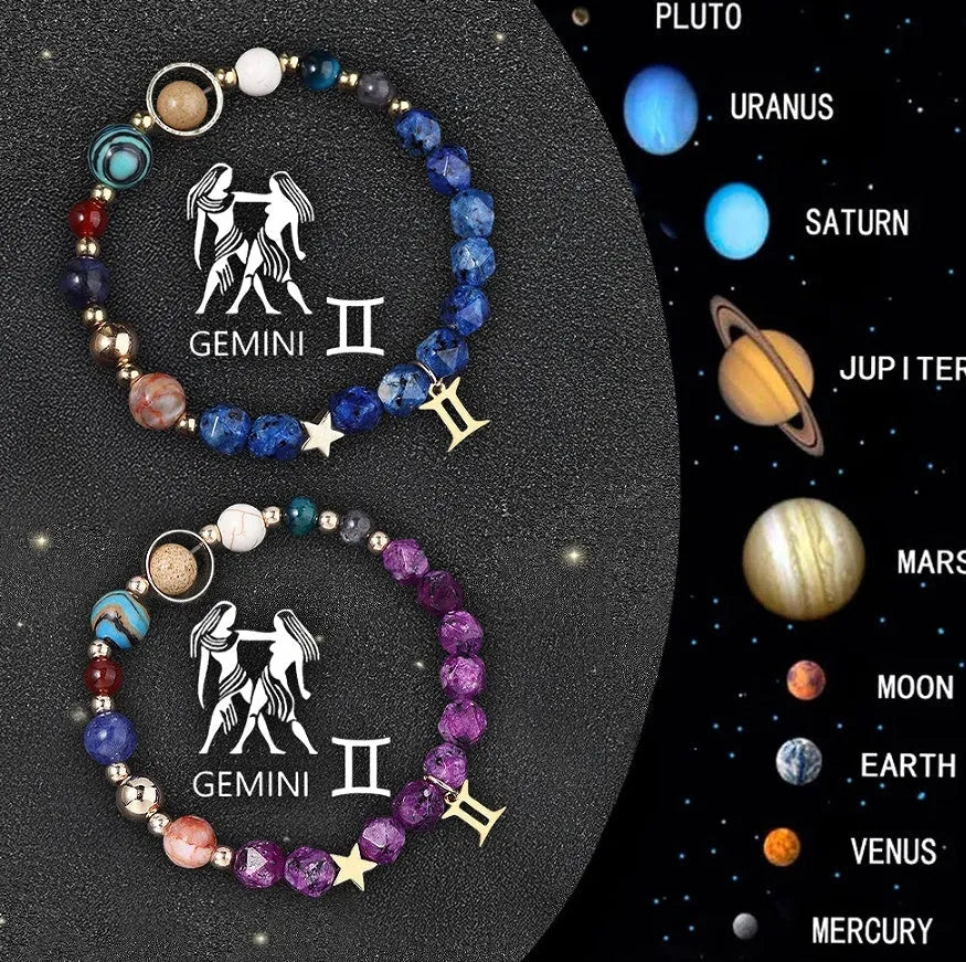 Set of two natural stone beaded bracelets with metal zodiac charms on a dark background.