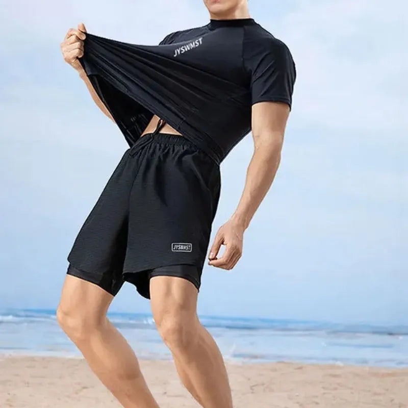 Men's plus size swimming set featuring a rash guard top and matching swim shorts on a grey background.