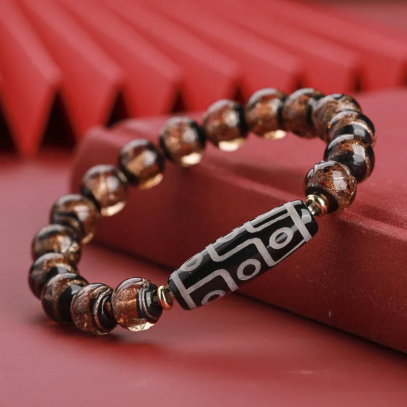 Chinese-style coloured glaze bracelet with five-colour design and Year of the Snake lucky beads.