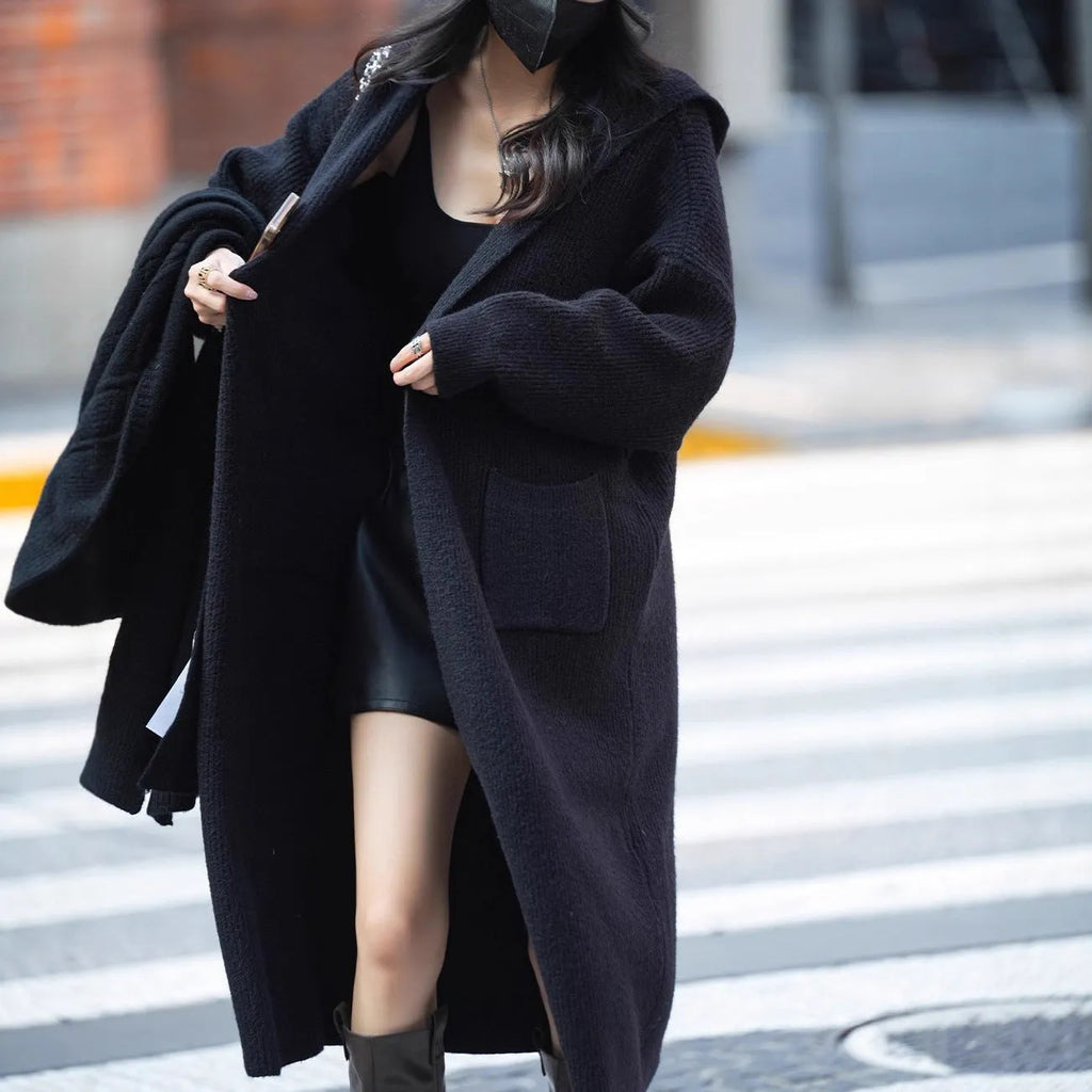 Long knitted hooded cardigan trench coat in wool blend cashmere fabric showing splicing sleeve details