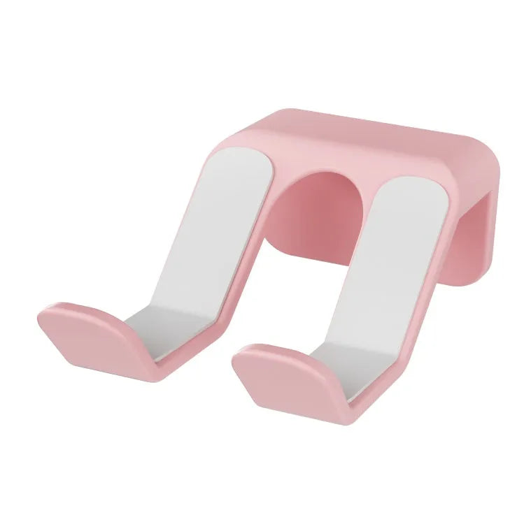 Universal game controller wall hanging rack in black, white, or pink colours with adhesive mounting options