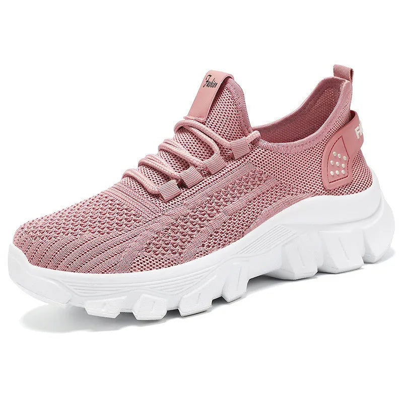Women's breathable Flyknit sneaker with thick bottom PVC sole and round toe in white, pink, beige, or black.
