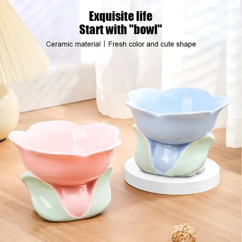 Blue ceramic elevated pet bowl with floral pattern for cats and small dogs on a non-slip base.