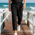 Men's light khaki linen casual trousers with a loose straight-leg fit and drawstring waist.