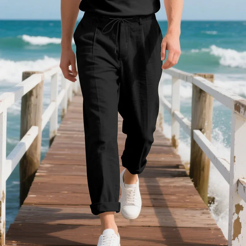 Men's light khaki linen casual trousers with a loose straight-leg fit and drawstring waist.