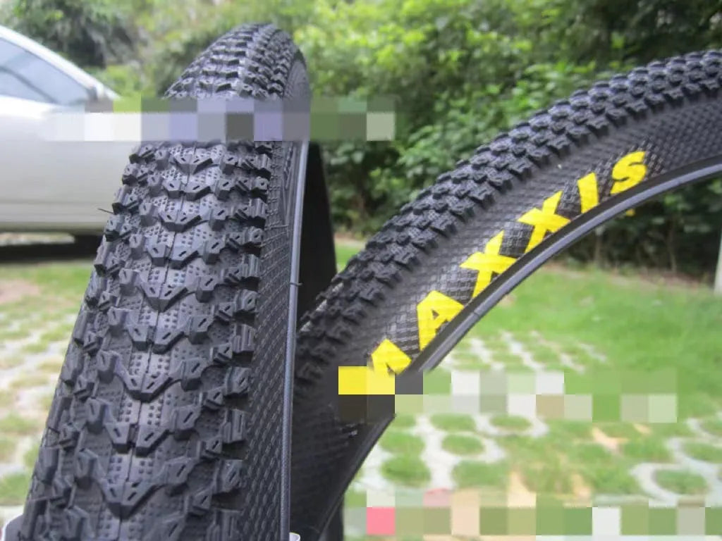 Ultralight puncture resistant mountain bike tyre shown in multiple sizes including 26, 27.5, and 29 inch diameters.
