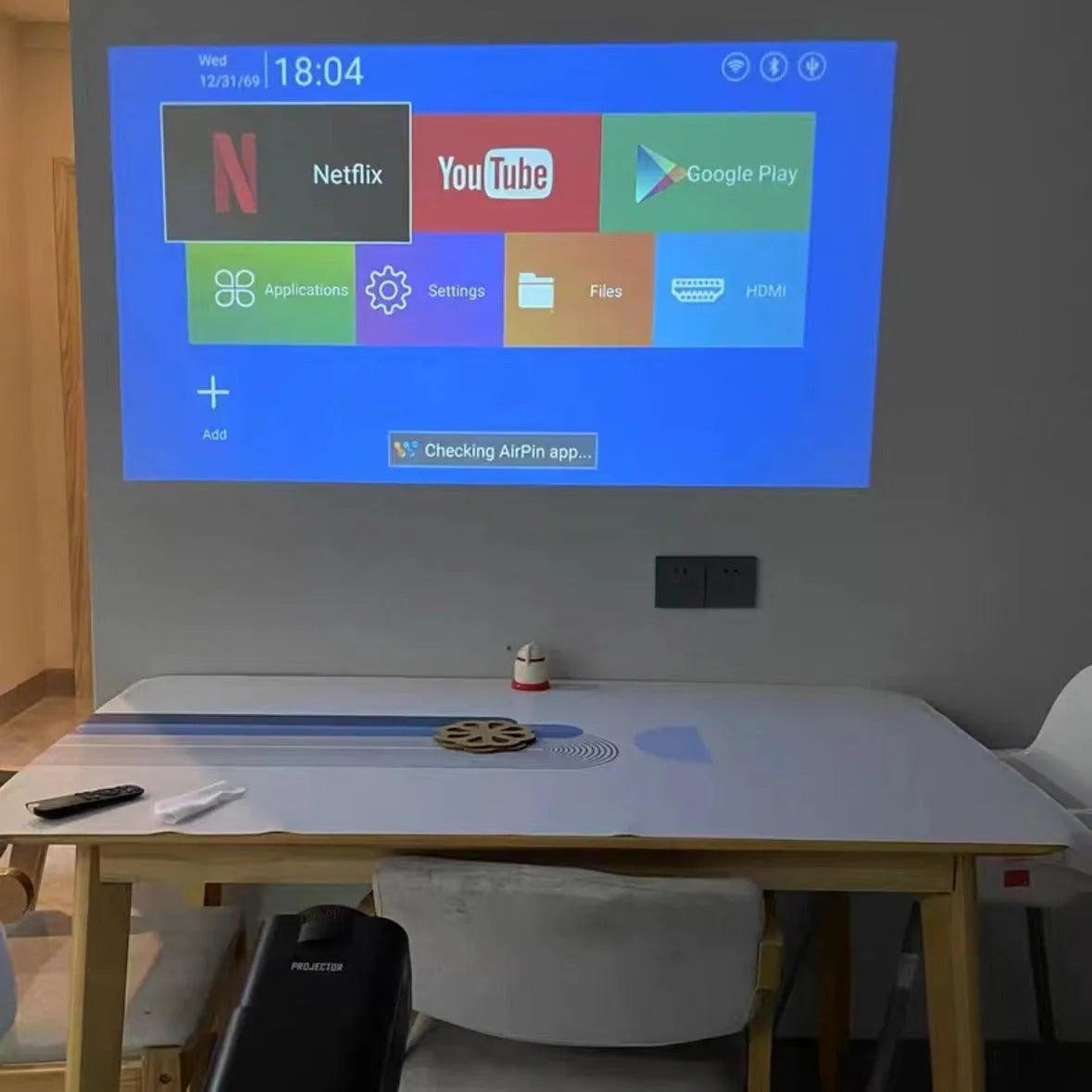 720p HD wireless home projector for gaming and screen projection on a table.