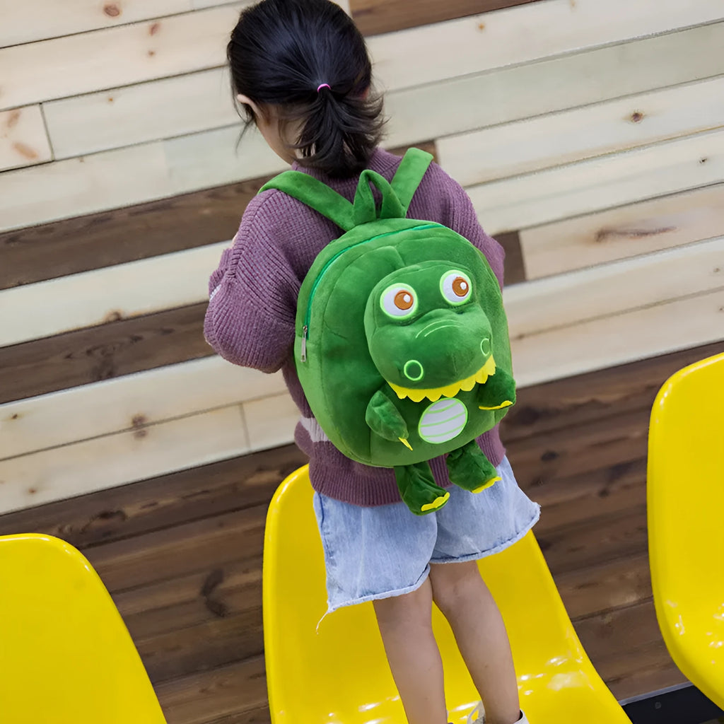 Blue soft plush dinosaur children's backpack with embroidery and a soft handle.