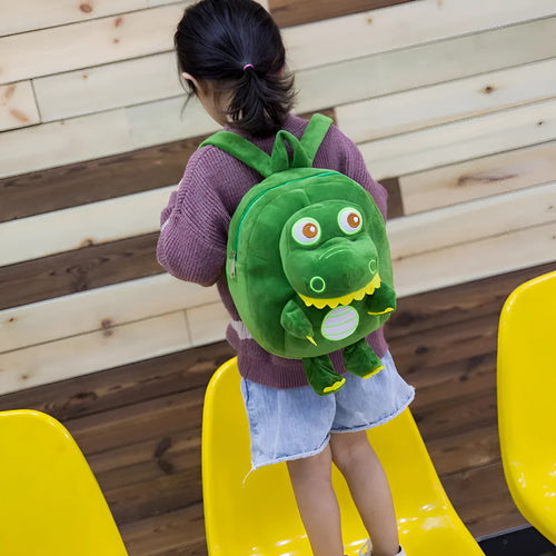 Blue soft plush dinosaur children's backpack with embroidery and a soft handle.