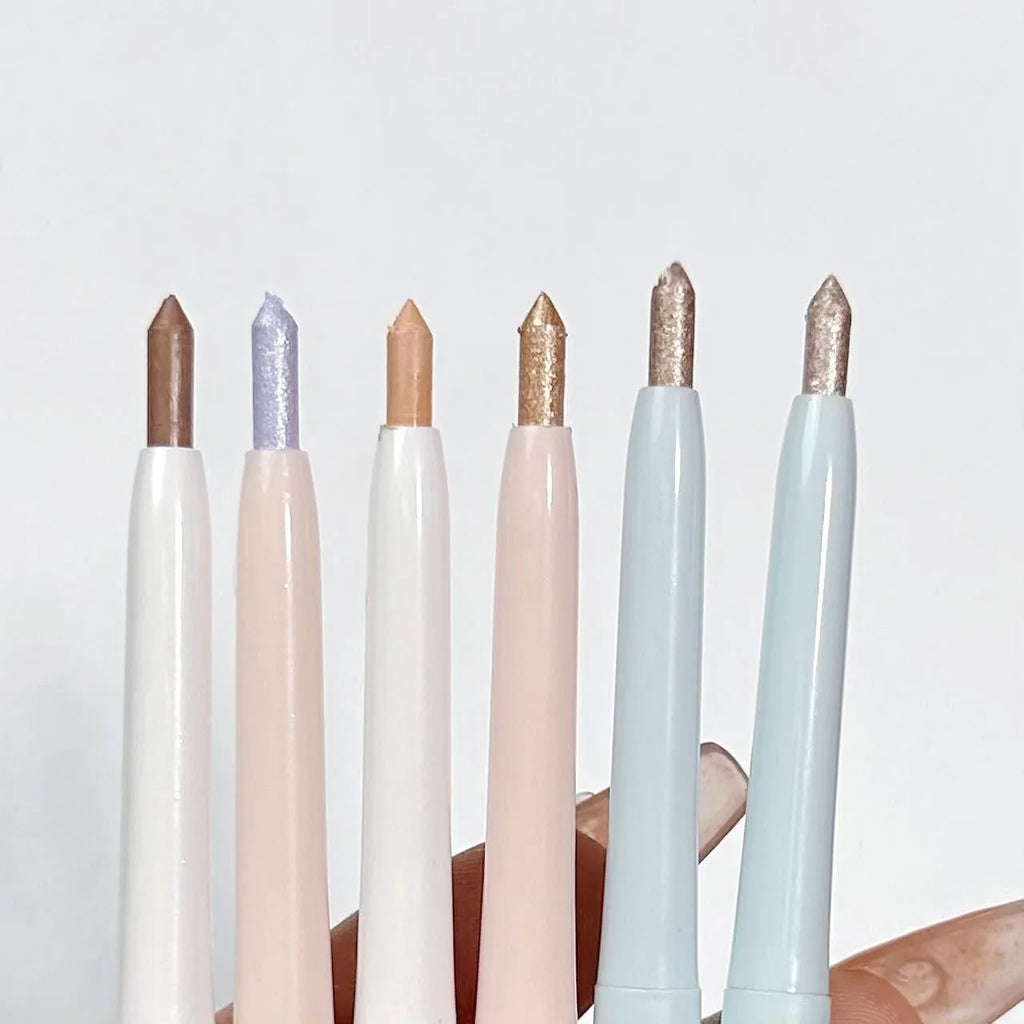Waterproof 2-in-1 eyeliner and eyeshadow pen in assorted colours on a white background