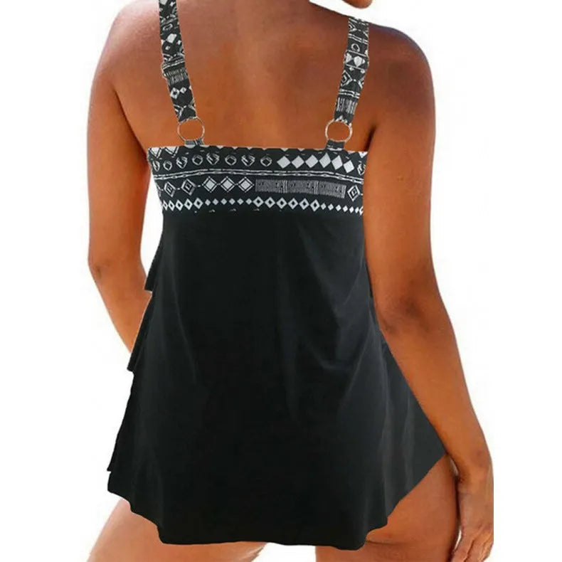 Plus-sized women's swimsuit with double shoulder straps, a bow, and split legs.