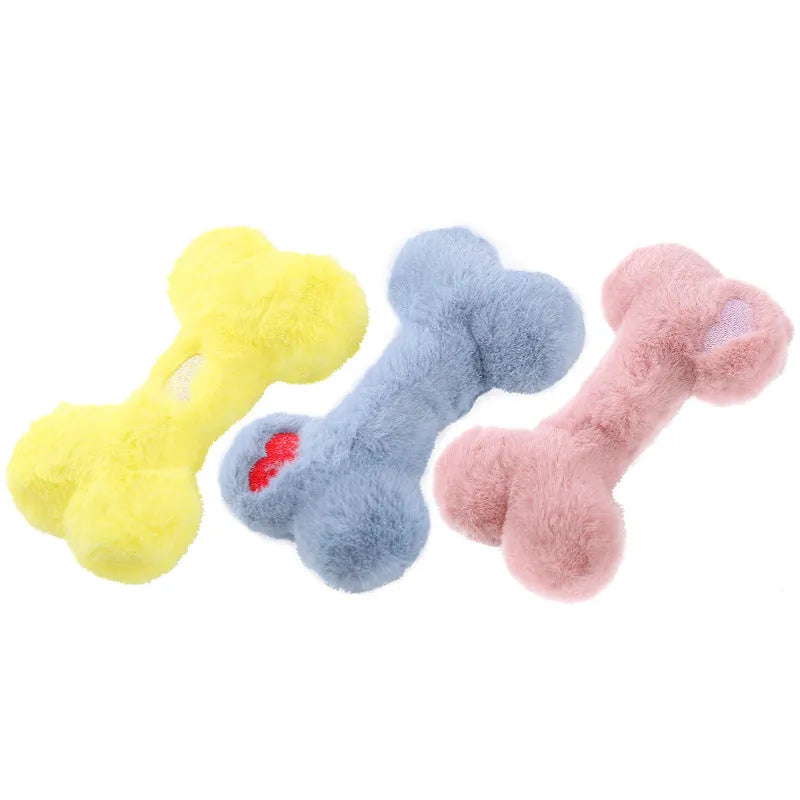 Cute love bone shaped plush dog toy in blue, pink, and yellow colours for interactive chewing play.