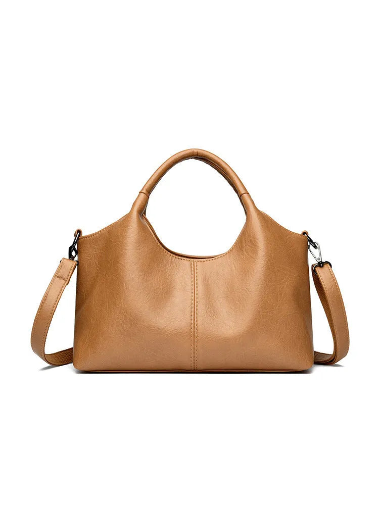 Genuine leather women's cross-body bag in a choice of seven colours including black, brown, and wine red