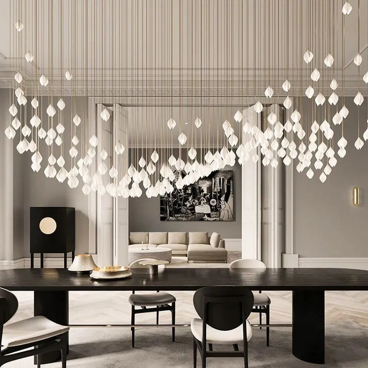Single head ceramic magnolia flower pendant chandelier light with a minimalist design.