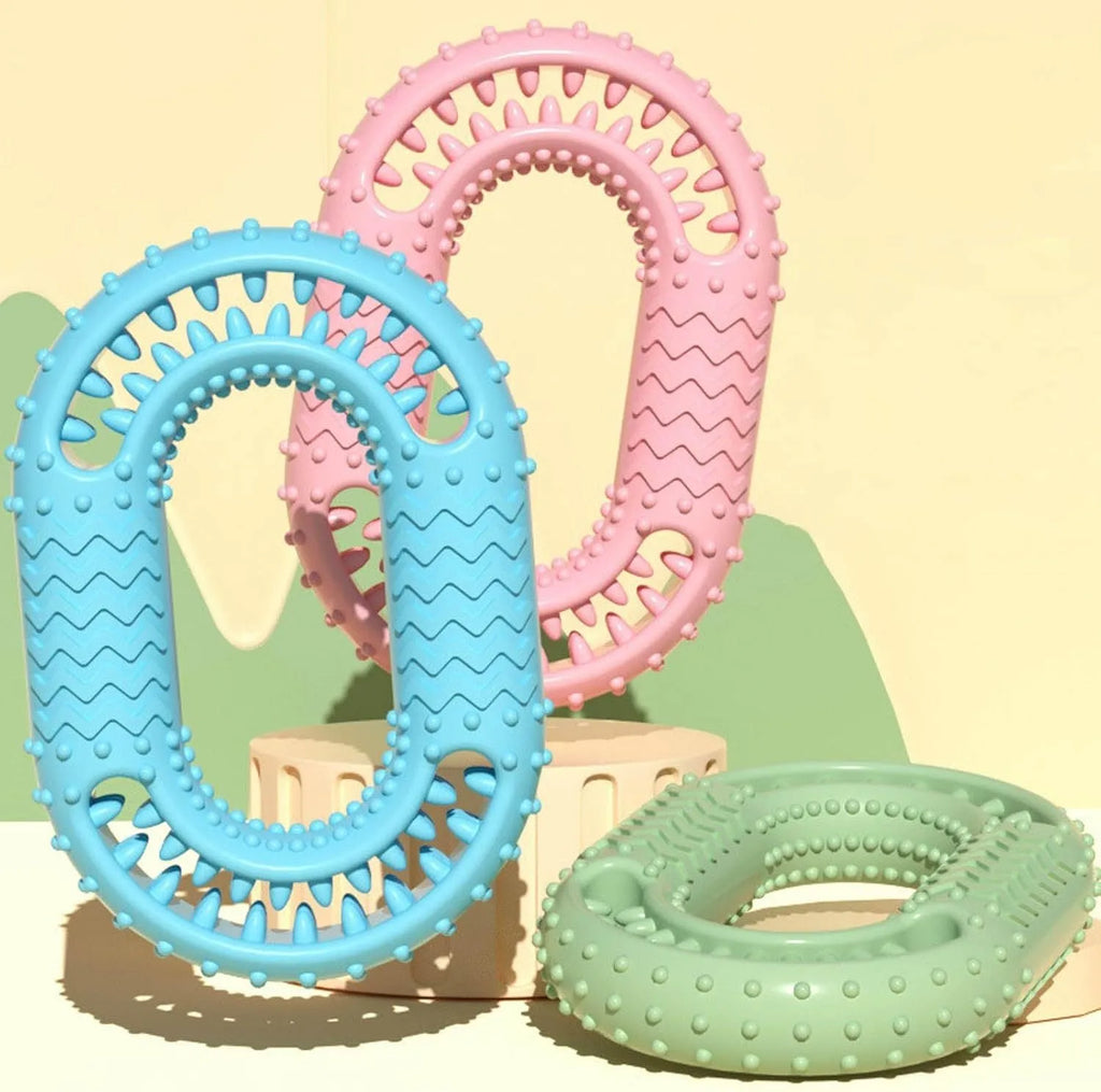 Blue O-ring shaped dog chew toy for aggressive chewers on a plain background.