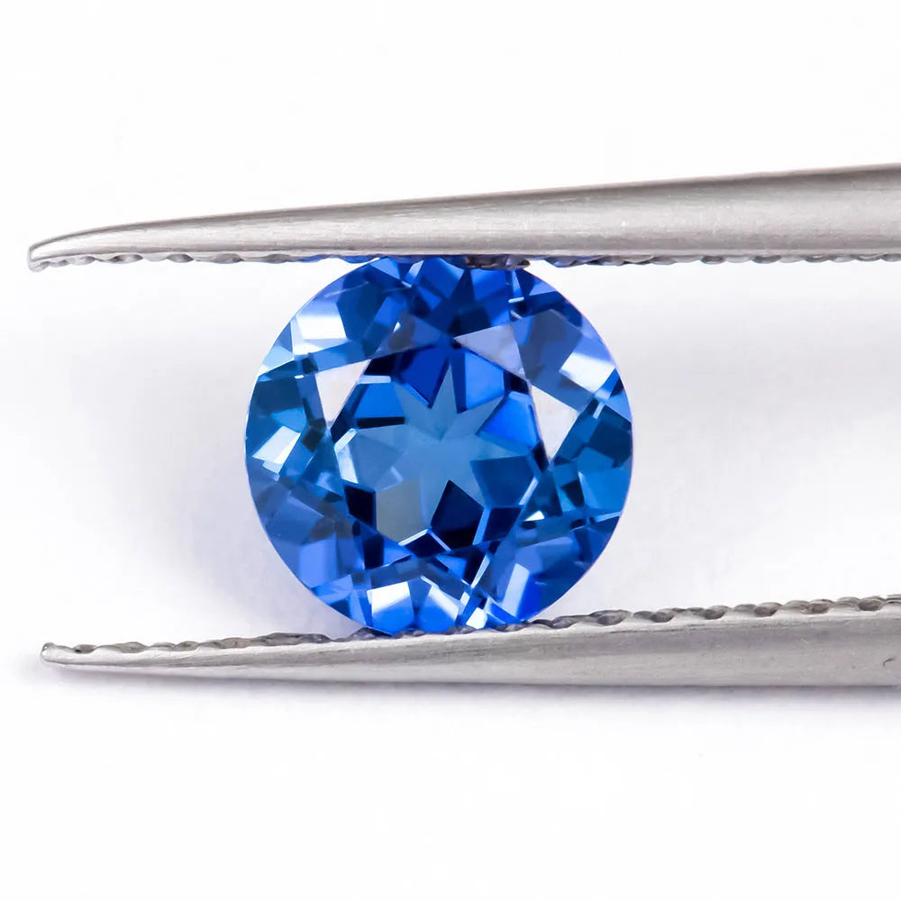 Royal blue synthetic gemstone showing heart, round, and pear cut shapes for jewellery making