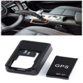 Small black plastic magnetic GPS car tracker device on a metal surface.