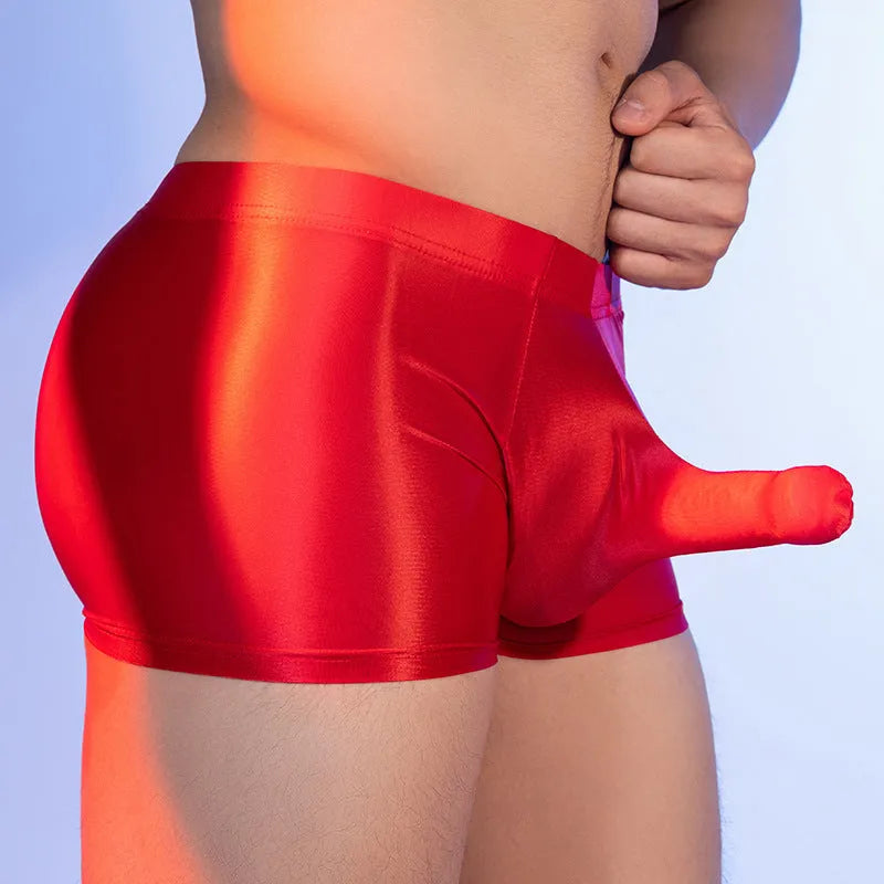 Men's red elephant nose boxer shorts made from thin nylon fabric, showing mid-waist and seamless design.