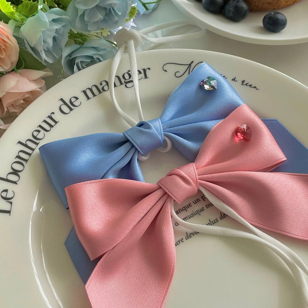 Dog wearing princess style bow hair band with tension adjustment on head