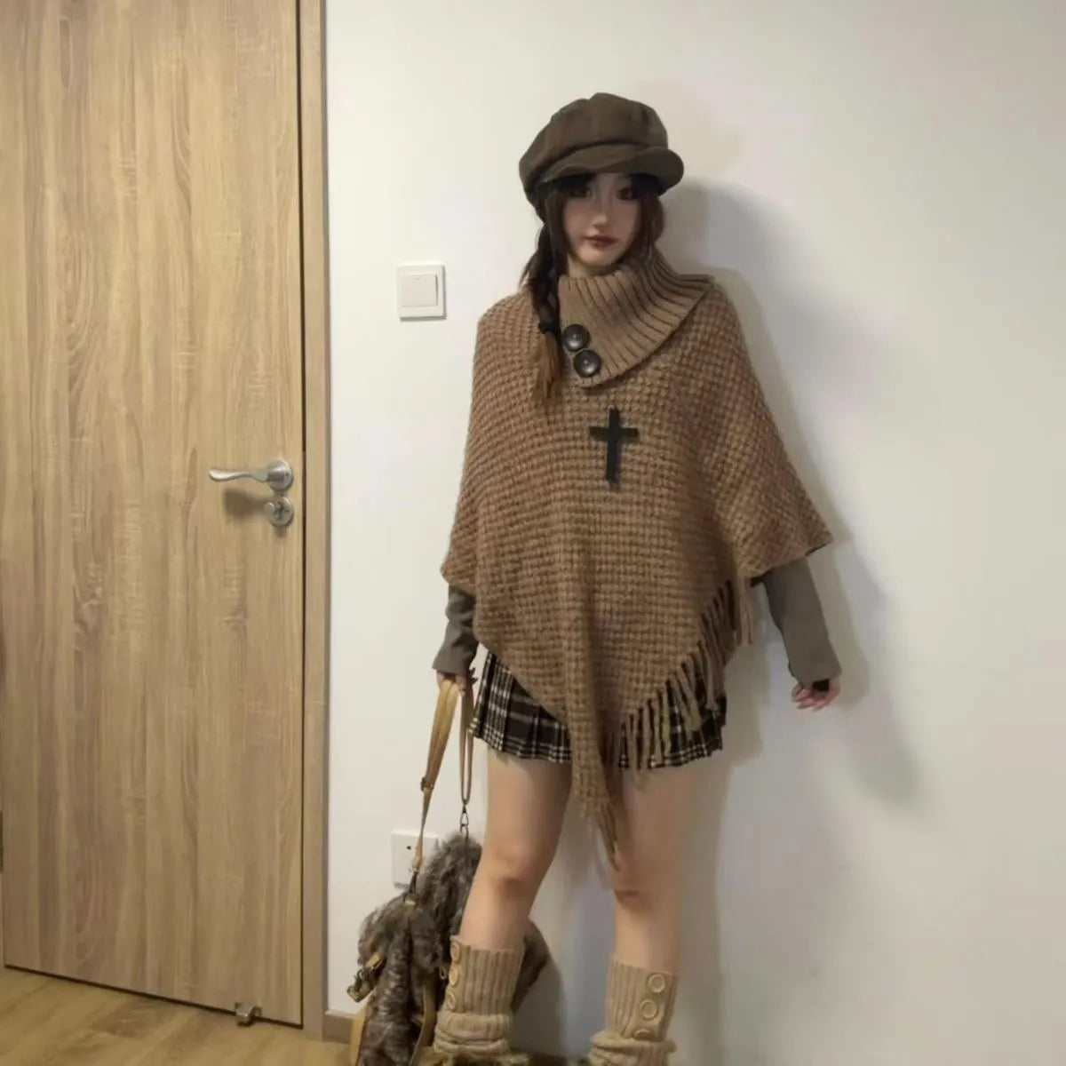 Women's triangle shawl cape in cashmere-acrylic blend with tassel detailing and plush texture
