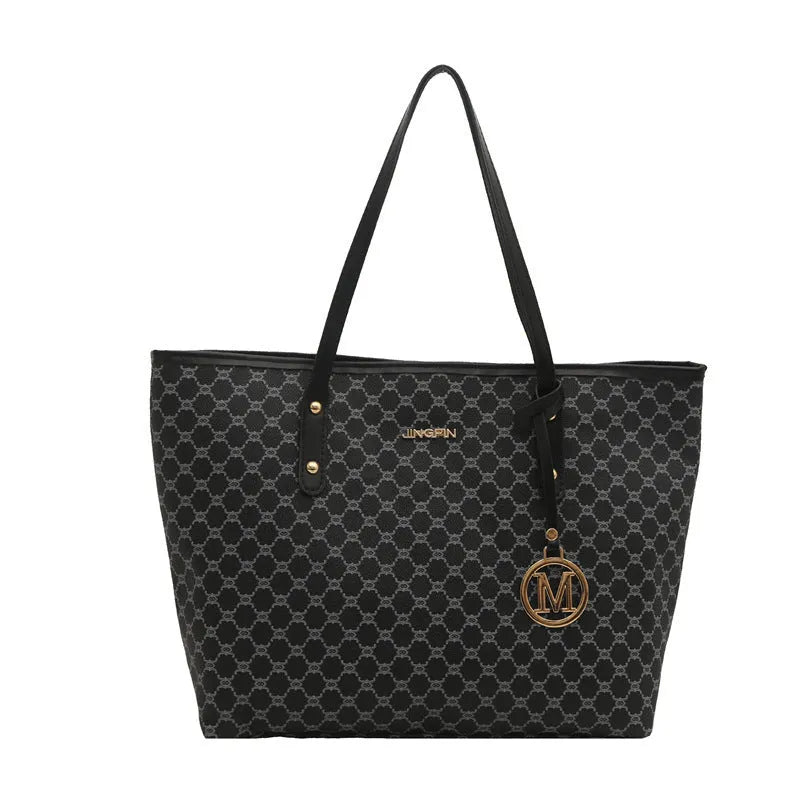 Structured black PU shoulder bag with sewing thread detail and a polyester lining.