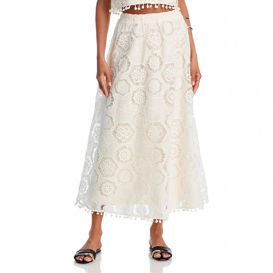 Women's white two-piece suit set with sleeveless top, long skirt, and retro embroidery detail