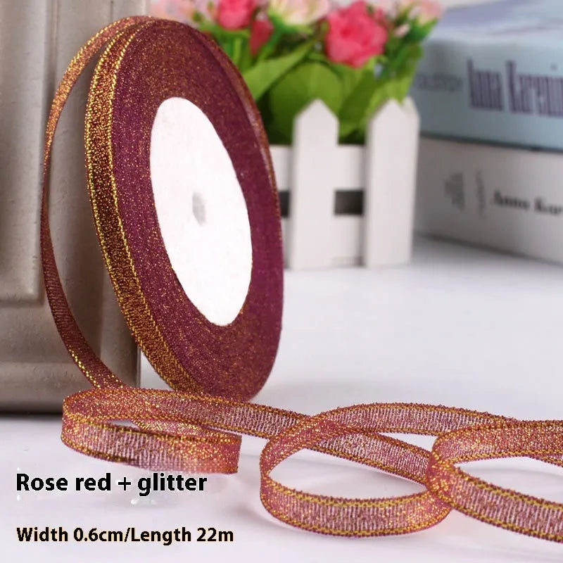 Roll of polyester gift ribbon showing 0.6cm width and multiple colour options including metallic finishes