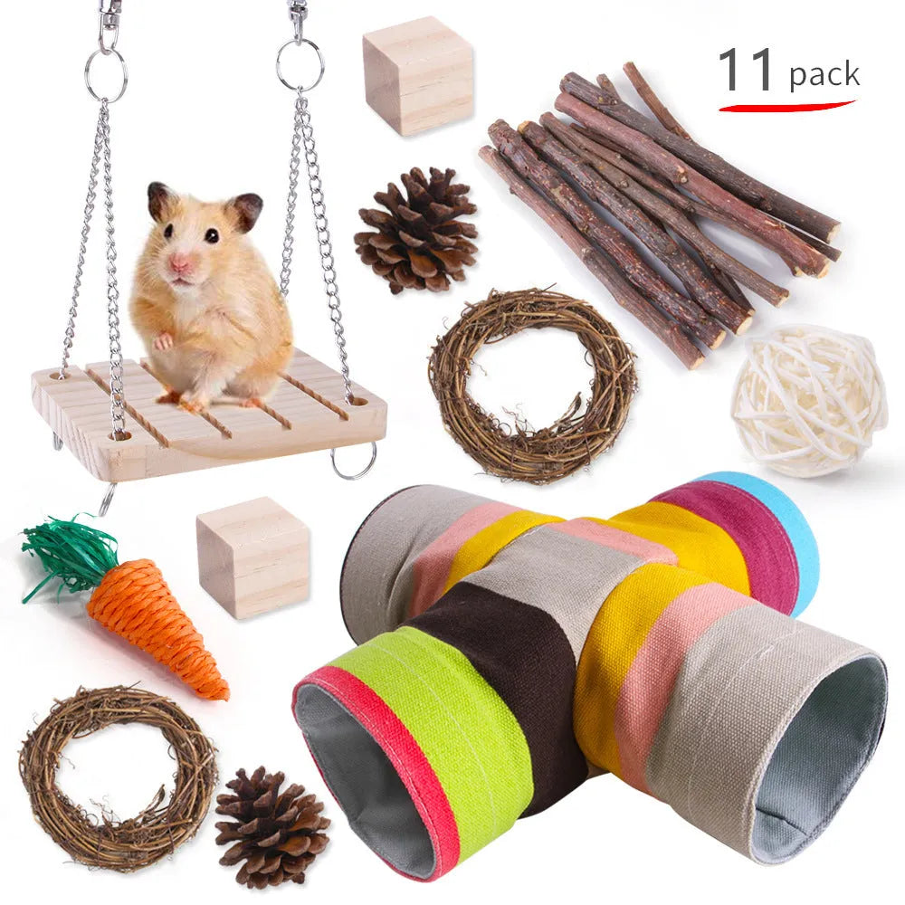 Assortment of wooden and natural fibre chewing toys for pet rabbits, guinea pigs, and parrots on a straw mat